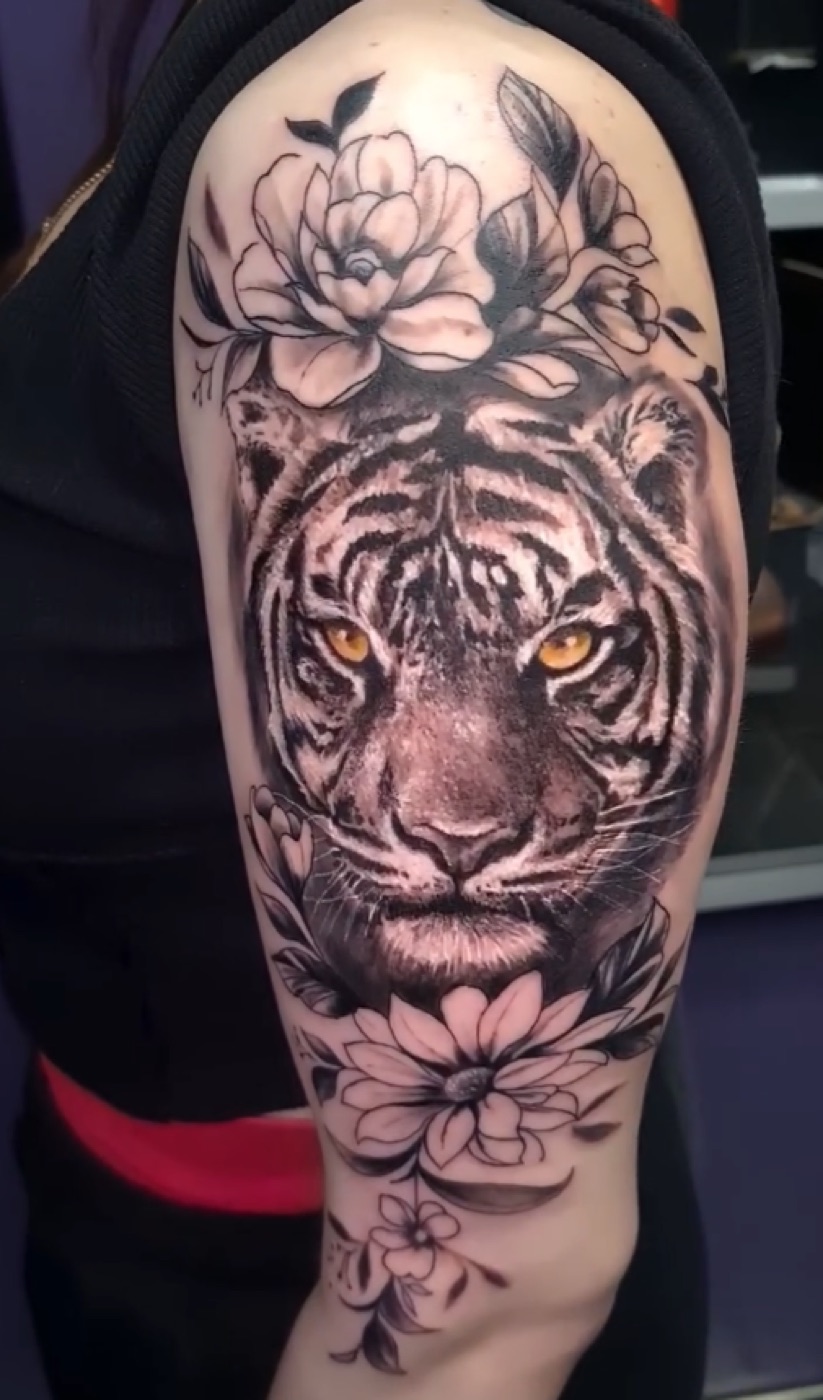 Black and grey tiger with florals tattoo