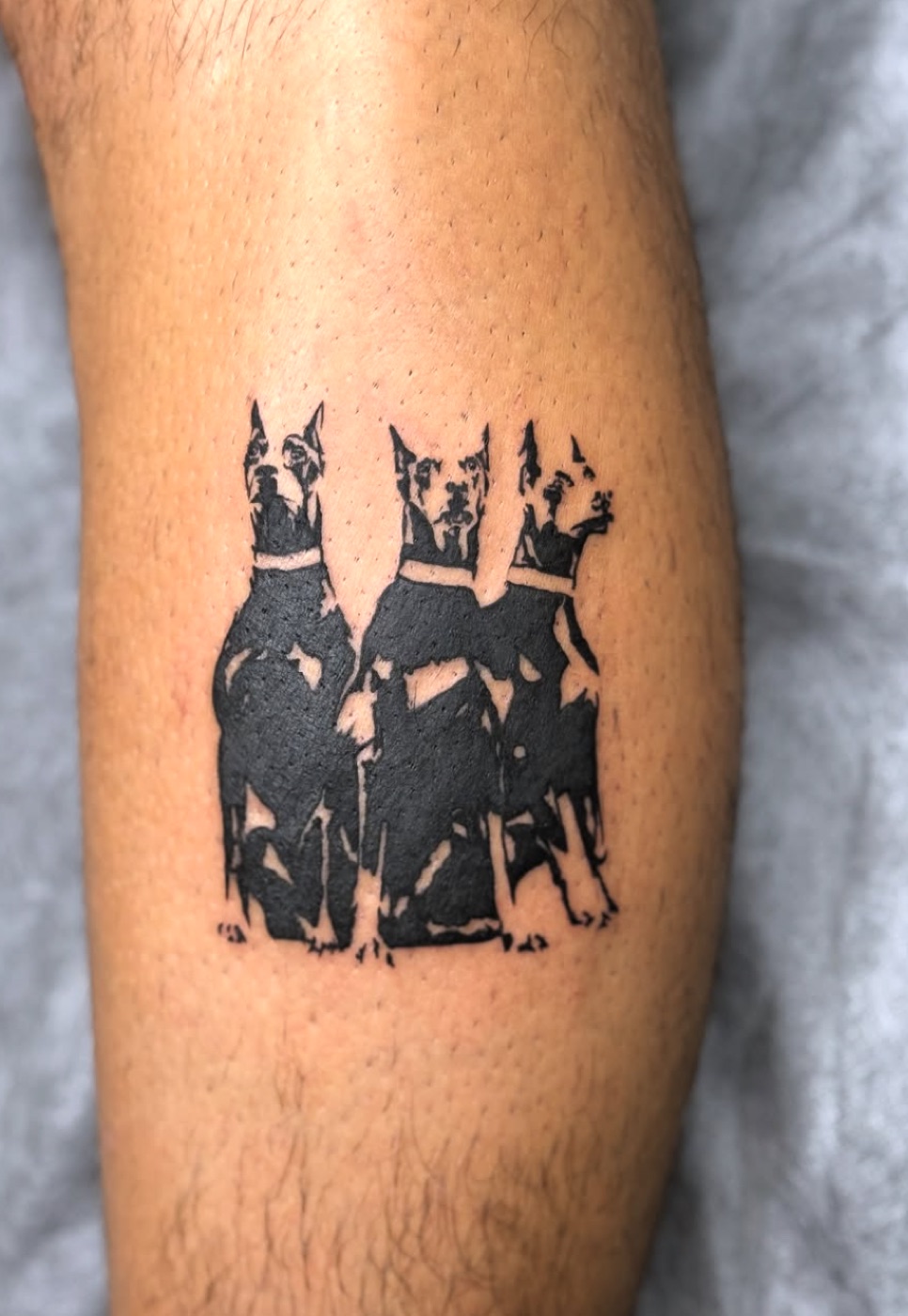 Blackwork doberman silhouettes tattoo