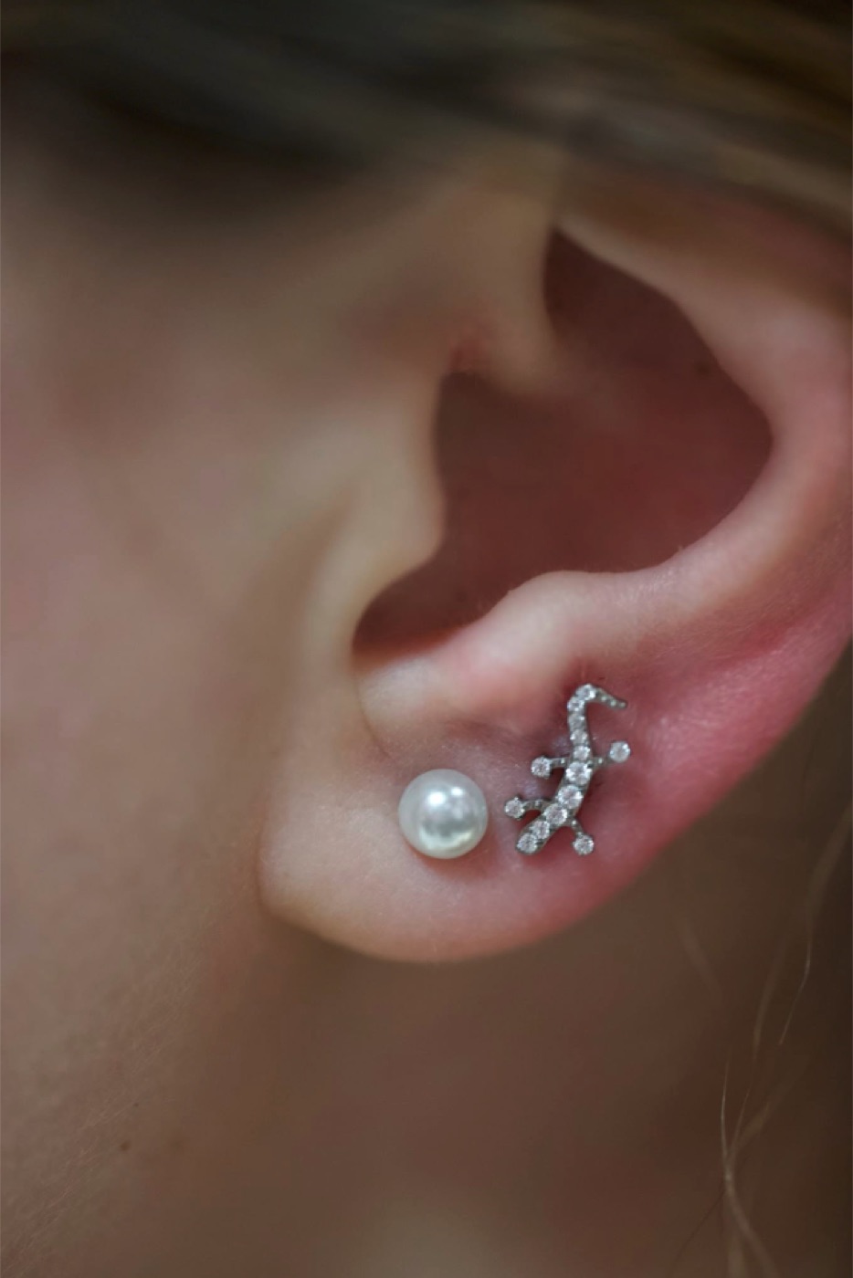 Tragus piercing with pearl jewelry