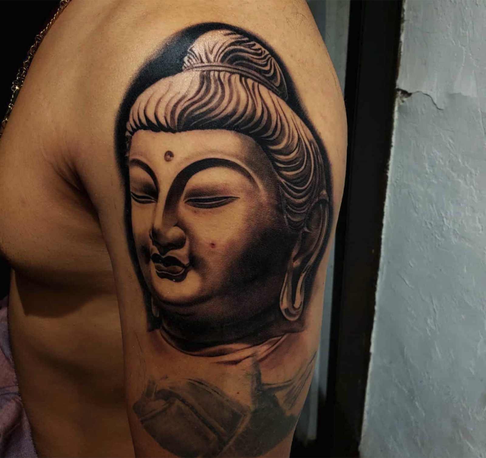 Black and grey Buddha tattoo