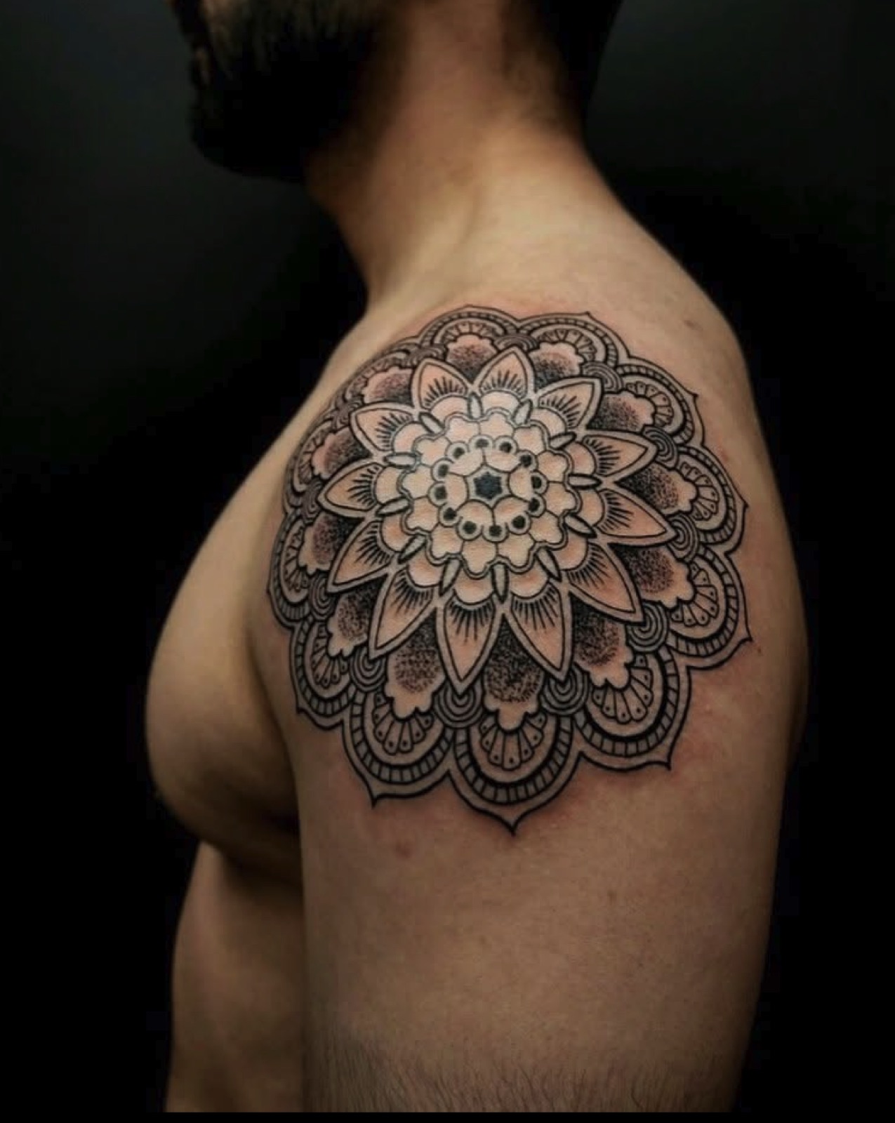Ornamental mandala shoulder tattoo