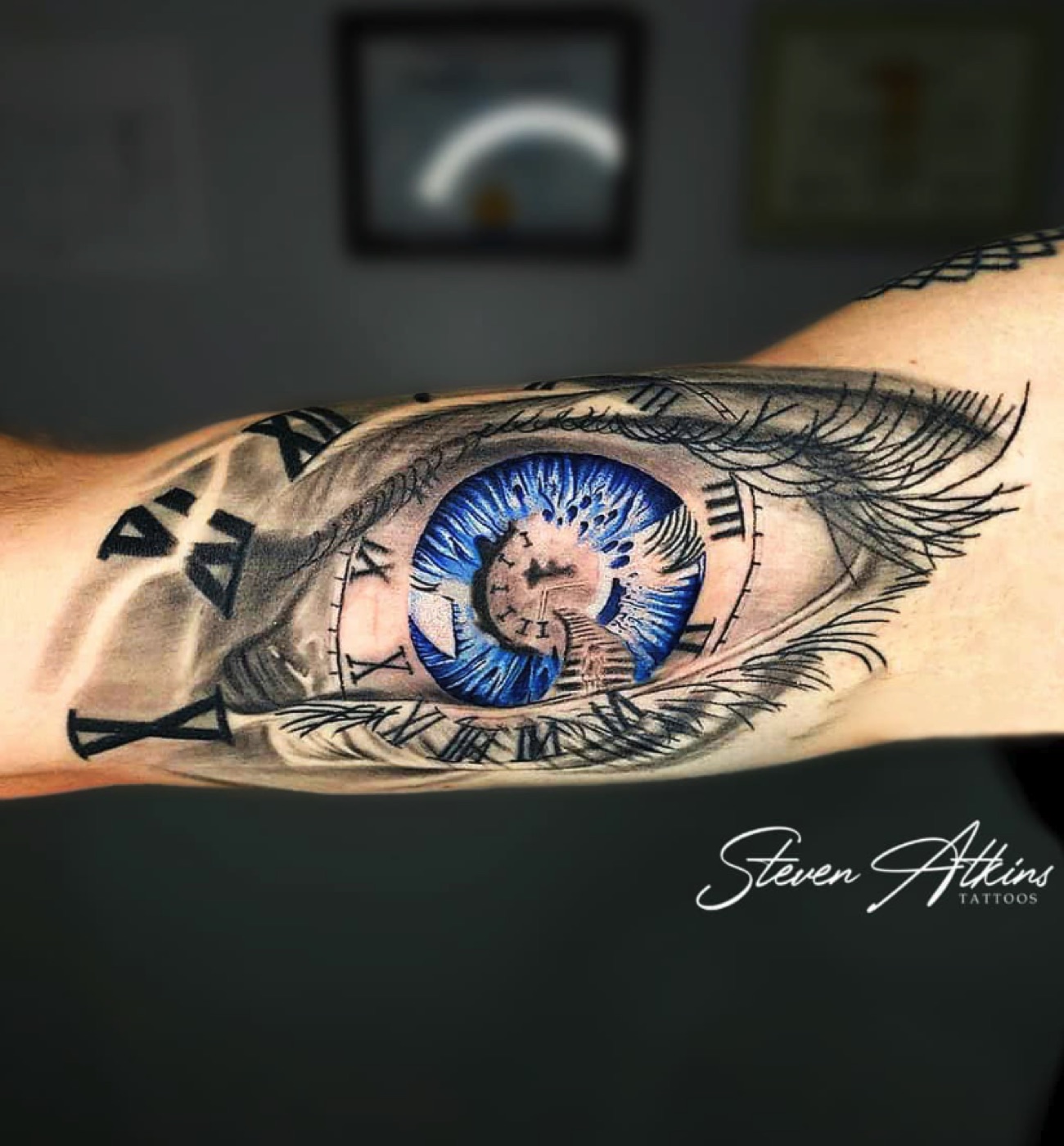 Realistic blue eye tattoo